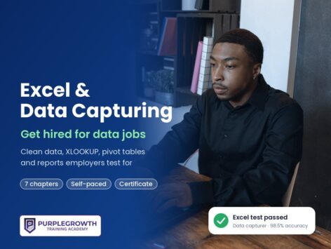Excel and Data Capturing course: a young man typing at a laptop in an office